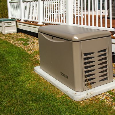 Newbury, USA - September 29, 2022: Residential standby generator on concrete pad